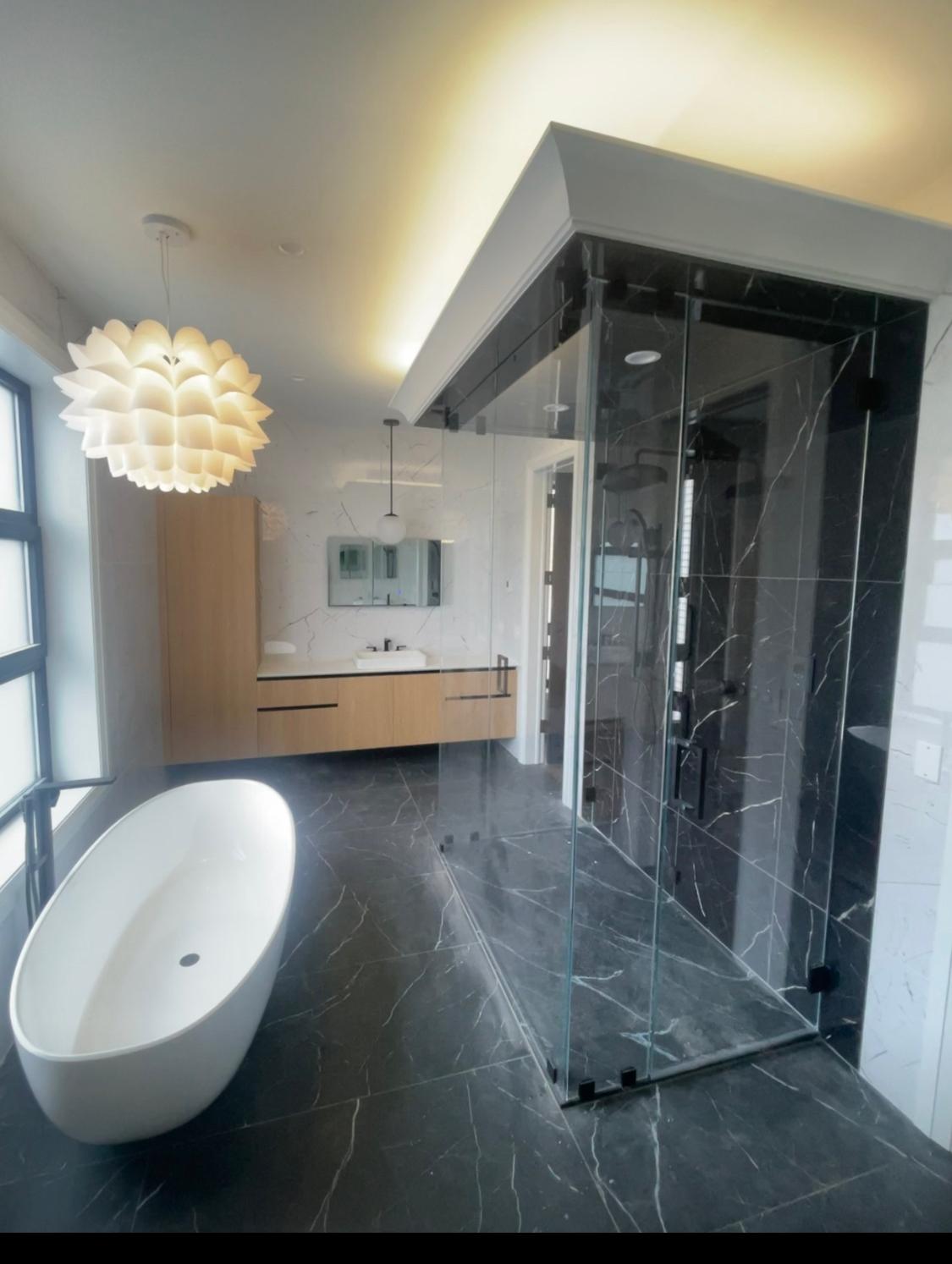 Dark marble spa bathroom with deep soaking tub