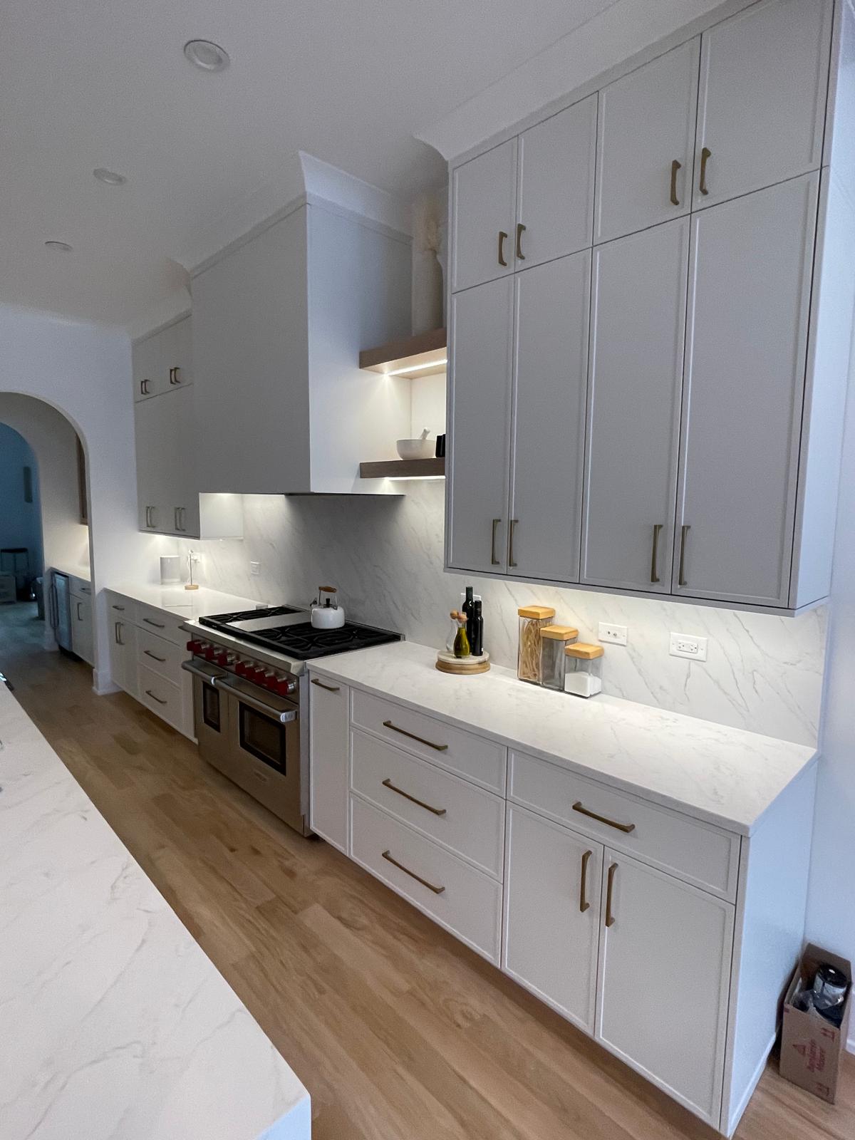 Custom kitchen cabinetry with brushed gold hardware